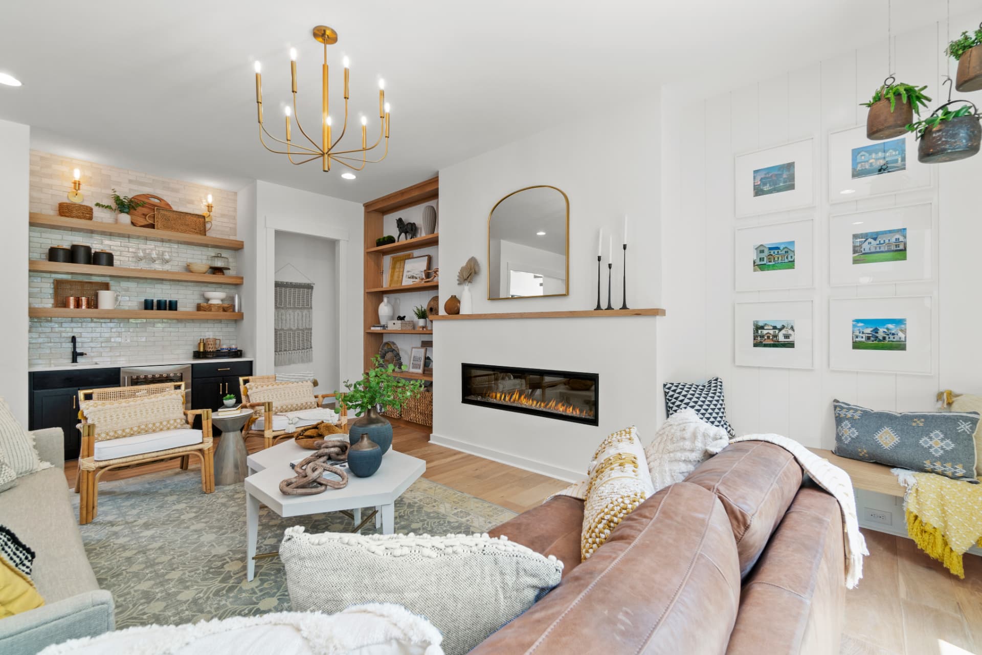Living room with built-in shelving and fireplace wall