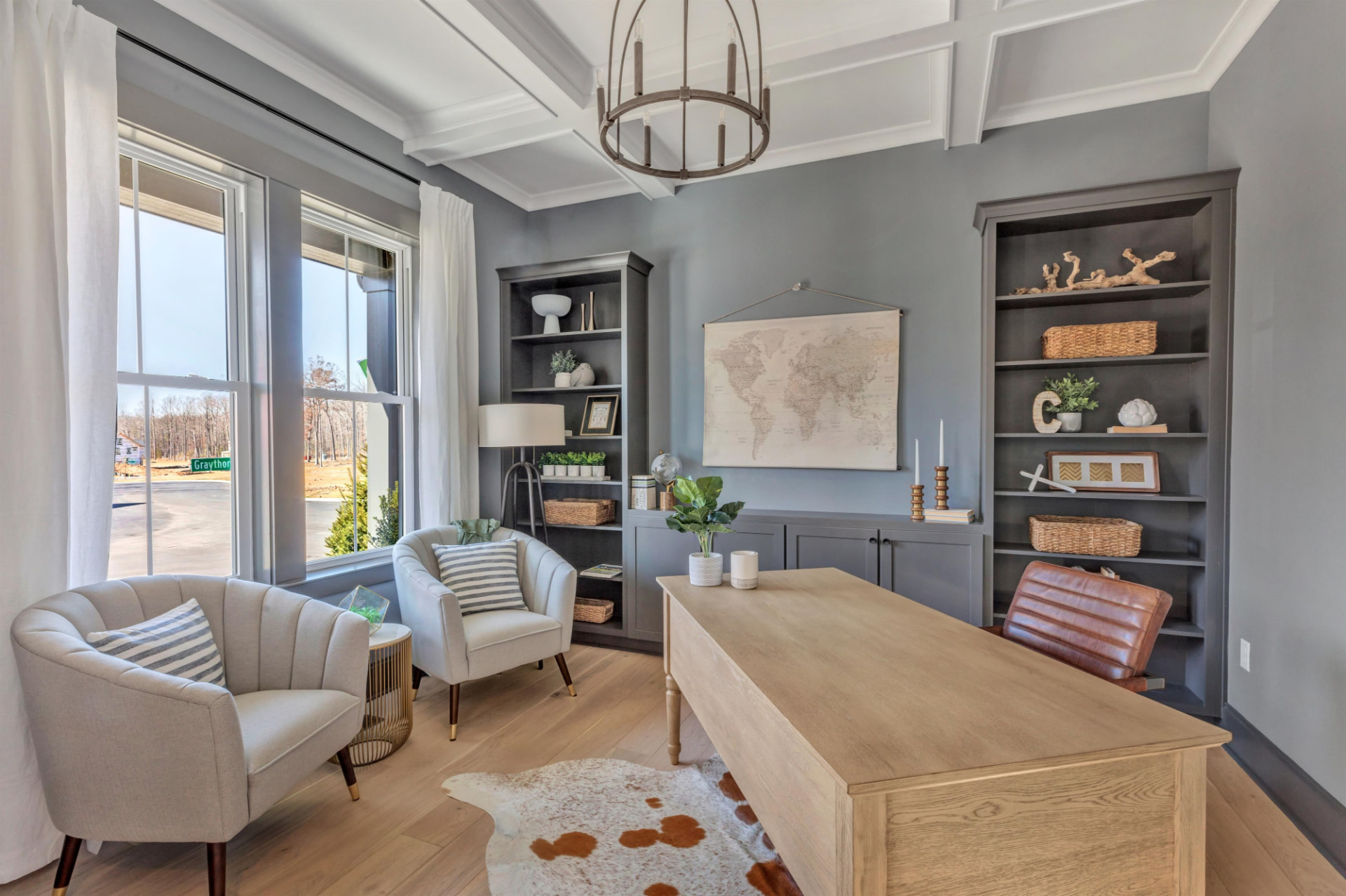 Study with painted built-in bookcases and base cabinets