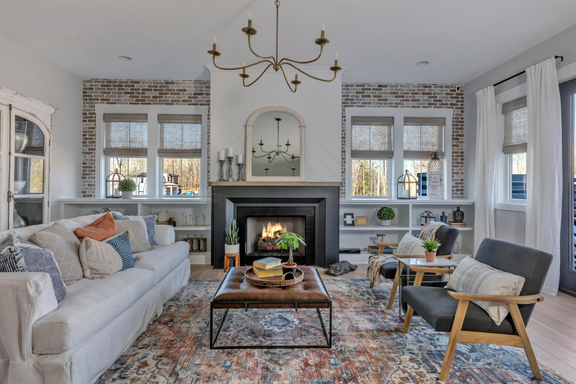 Living room with white built-in shelving flanking the fireplace
